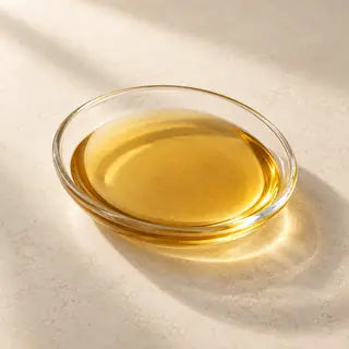 AI-generated amber oil illustration for vitamin E; not an actual supplied material or dose reference